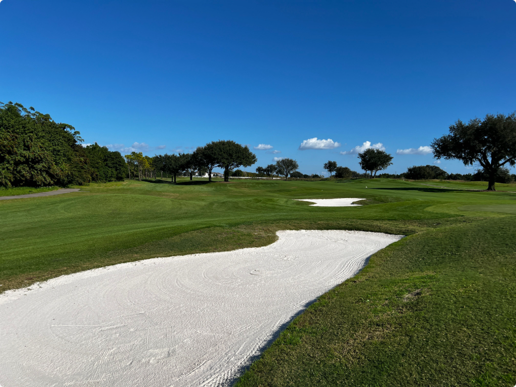 Florida golf course with white sand bunker